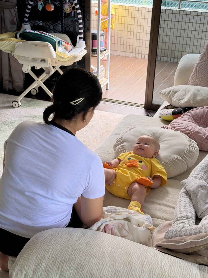 Helper caring for an infant